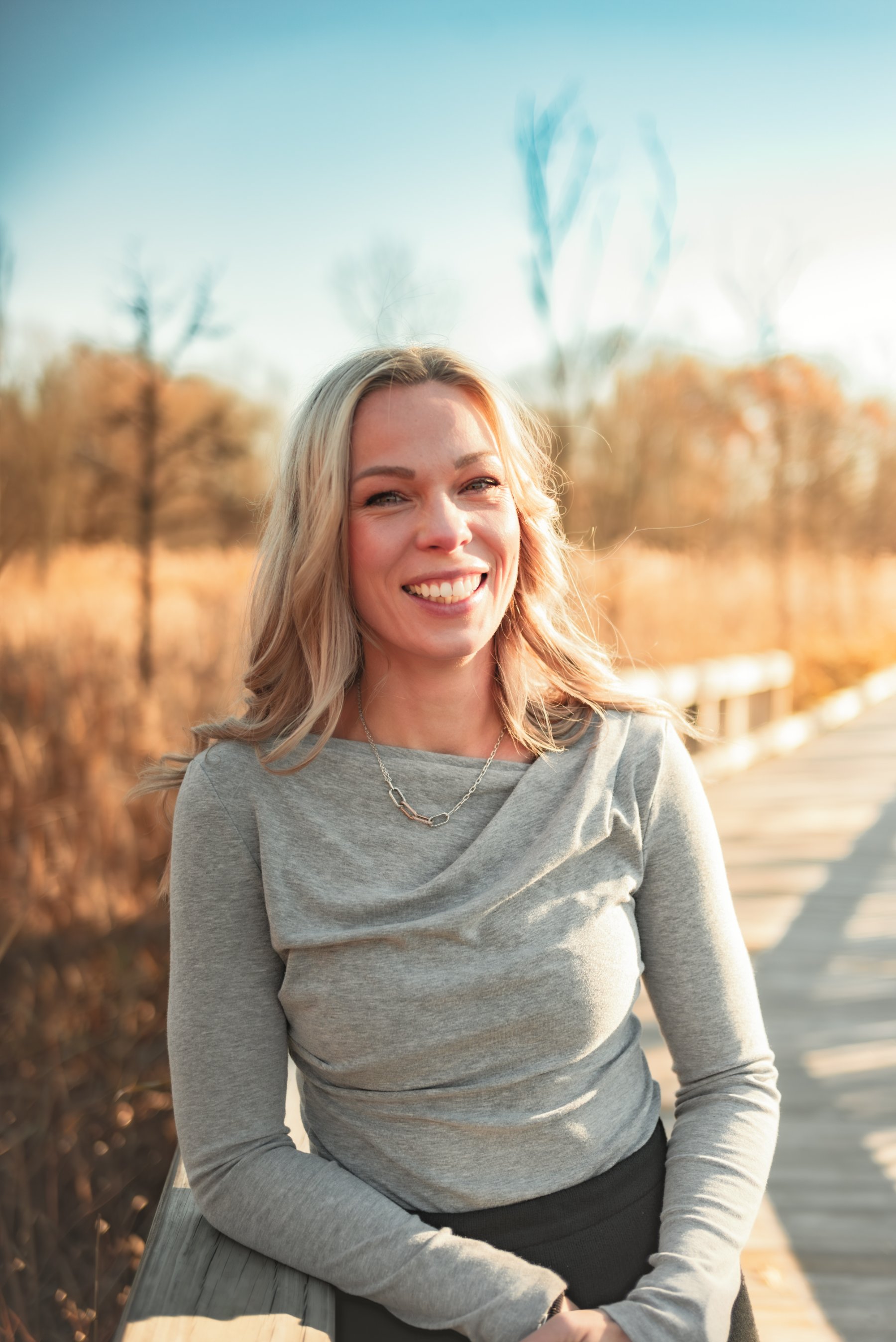 Golden hour portrait on a boardwalk by Christa V Photography